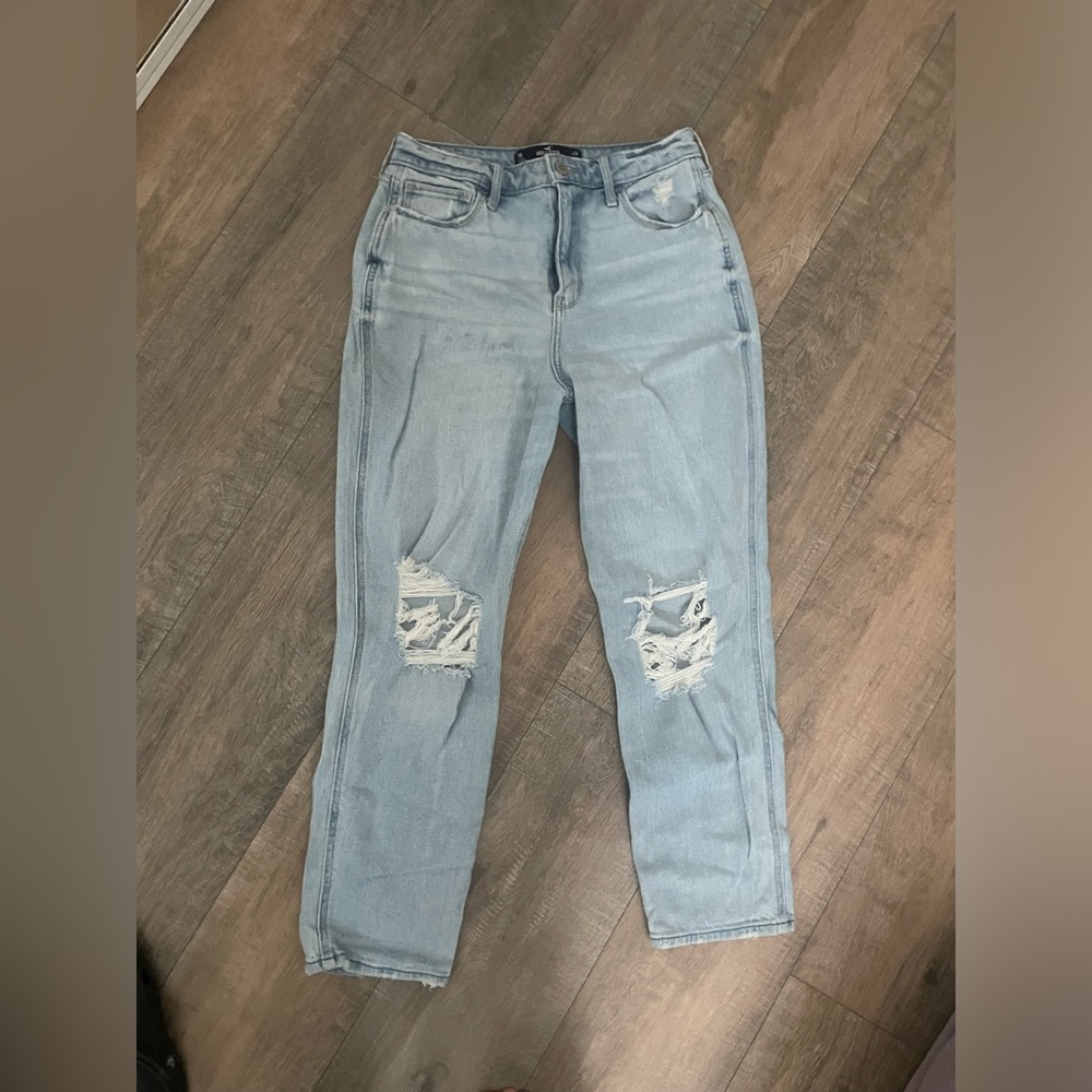 Light blue Hollister jeans with rips and the knees.